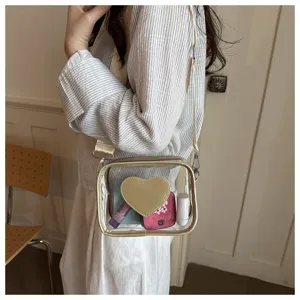 Sac bandoulière transparent en PVC avec sangle large et design cœur, sac d'été tendance.