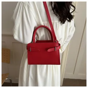 Red leather shoulder handbag for women, chic crossbody bag with top handle for daily fashion.