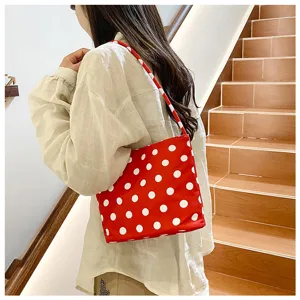 Chic red polka dot shoulder bag for women, stylish underarm handbag for daily casual outdoor use.