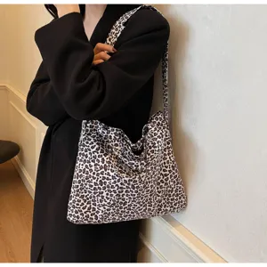 Stylish leopard print canvas tote bag, large capacity shoulder bag for daily casual wear.