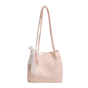 Bolso de hombro estilo japonés rosa de lunares con asas trenzadas y bonito lazo decorativo