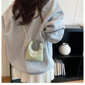 Chic spring summer mini crossbody bag with cute lace trim and metal ring handle for women.