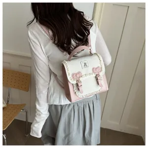 Detail view of sweet style pink and white mini backpack with cute lace ruffles and bowknots.
