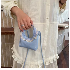 Spring summer fashion mini crescent crossbody bag with cute lace ruffle trim and PU leather.