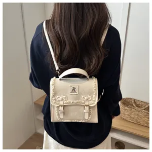 Sweet white leather mini backpack for women with cute lace trim and teddy bear patch bag.