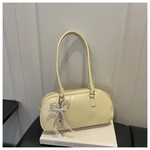 Sac à bandoulière jaune élégant pour femmes, design chic de sac oreiller avec nœud de perles.