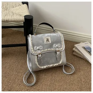 Stylish silver women backpack with cute lace trim and lovely bowknot design for daily use.