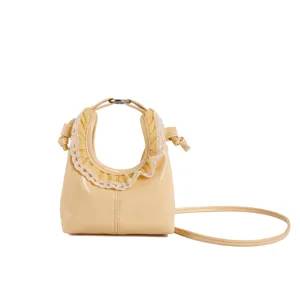 Yellow mini crossbody bag with cute lace ruffles, stylish crescent handbag for women and girls.