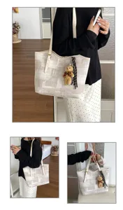 Detailed view of large capacity tote bag with minimalist geometric pattern and cute bear pendant.