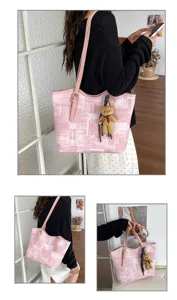 Detailed view of the large pink plaid tote bag with cute bear charm, ideal for daily use.
