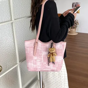 Pink tote bag for women, large capacity shoulder handbag with cute bear pendant for daily commute.