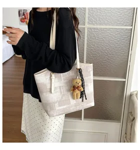 Casual large capacity tote bag for women, chic plaid shoulder bag with cute bear pendant.