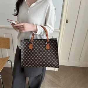 Elegante borsa tote con monogramma da donna, borsa a spalla classica con manici per uso quotidiano.