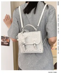 Elegante zainetto bianco da donna per ragazze, con motivo a stelle e grazioso design a fiocco.