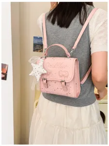 Bellissimo zaino rosa con motivo a stelle dettaglio con fiocco e ciondolo, design casual.