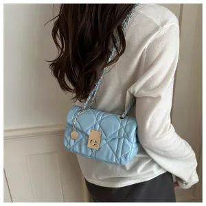 Trendy quilted shoulder bag for women, stylish light blue crossbody bag with chain strap.