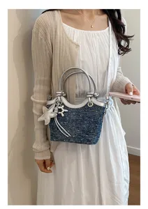 Cross-border denim bucket bag with silver leather trim and cute charms, stylish shoulder bag.