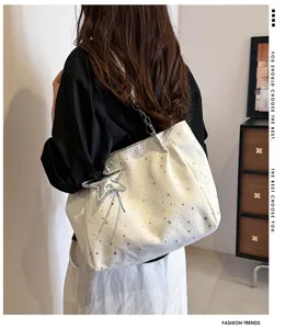 Large capacity star patterned tote bag with chain strap and cute star pendant for women.