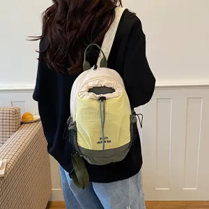 Color-blocked multi-functional lightweight waterproof casual backpack and stylish crossbody bag.