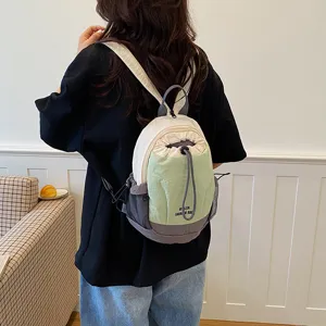 Detailed view of lightweight colorblock canvas mini backpack with drawstring closure.