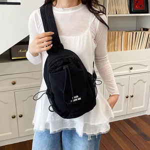 Black casual multifunctional chest bag with drawstring front pocket and mesh side storage.