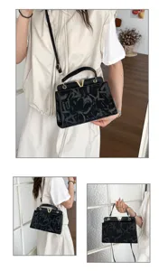 Stylish women handbag crossbody shoulder bag with chic metal V buckle and patterned design.