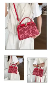 Red small square shoulder handbag with metal V logo, stylish chic crossbody bag for women.