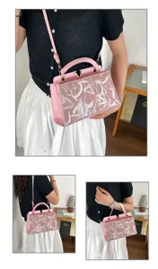 Pink women's shoulder handbag with monogram pattern and metal V clasp for summer daily wear.