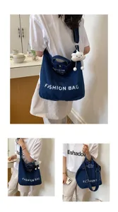 Japanese style canvas shoulder bag large capacity denim crossbody bag for daily commute.