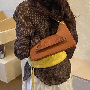 Chic asymmetric brown crossbody bag with croc-embossed flap, trendy summer casual shoulder purse.