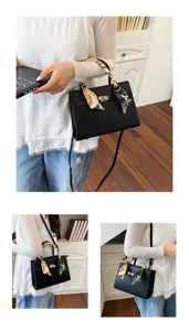 Black leather handbag for women, retro casual shoulder bag with silk scarf handle detail.