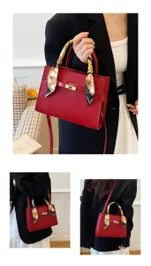 Elegant red women handbag with silk scarf, classic structured top handle shoulder bag.