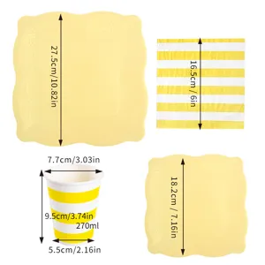 Yellow disposable party tableware set with embossed paper plates cups and napkins for events.