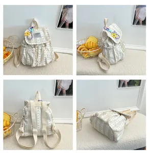 Detail view of the sweet striped canvas backpack featuring cute bow prints and drawstring closure.