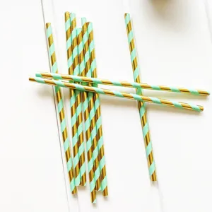 Disposable paper straws set, mint green and gold striped design for birthday party celebration.