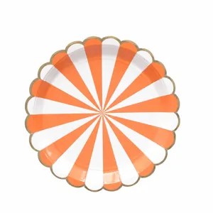 Orange white stripe paper plate detail showing gold scalloped edge party tableware.