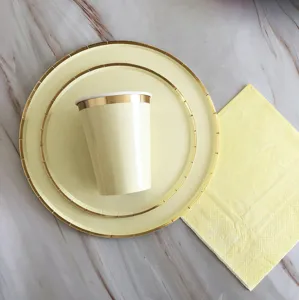 Disposable paper plates gold foil yellow cake plates detail view for birthday party decor