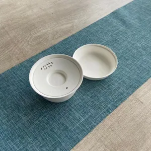 Portable disposable tea set detail shot, eco-friendly paper pulp tea cup for travel and brewing.