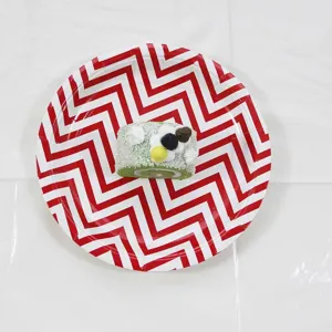 Disposable red and white chevron paper plate detail view for party events use