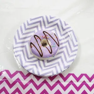 Disposable paper plates with purple chevron pattern for birthday party and celebrations.