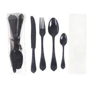 Detailed view of disposable black plastic cutlery set showcasing intricate vintage handles.