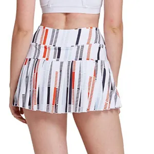 Back view detail of women athletic tennis golf pleated skort with colorful stripe print.