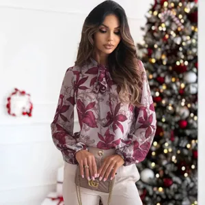 Elegante camicia da donna a maniche lunghe con collo a fiocco e chic stampa floreale.