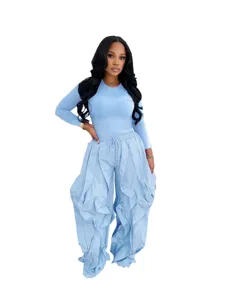 Light blue two-piece set featuring a fitted long-sleeve top and ruffled wide-leg pants.