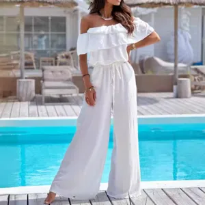 Donna tuta elegante e alla moda monocolore spalle scoperte volant vita alta gamba larga.