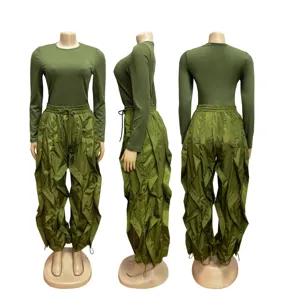 Detailed multi-angle view of green long sleeve top and unique ruffle wide leg pants set.
