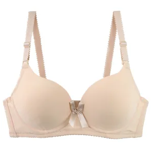 Detail shot of seamless padded bra cup texture, smooth solid color surface and adjustable strap.