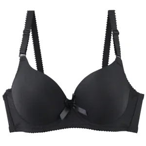 Detailed close-up of seamless black bra cups, adjustable straps, and cute center bow design.