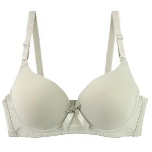 Seamless solid color padded bra detail showcasing smooth cups and adjustable wide straps.