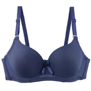 Seamless solid color padded bra detail showing smooth molded cups and adjustable straps.